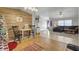 Bright dining area features a wood accent wall, tile flooring, and a charming table with two chairs at 250 W Medina St, Summerville, SC 29483