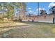 Tan mobile home exterior with deck and large backyard at 250 W Medina St, Summerville, SC 29483