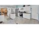 White kitchen cabinets, butcher block countertops, and stainless steel appliances at 250 W Medina St, Summerville, SC 29483