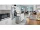 This kitchen features white cabinets, stainless steel appliances and an island at 250 W Medina St, Summerville, SC 29483