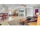 Open concept living room and dining area with gray sectional sofa and red barstools at 250 W Medina St, Summerville, SC 29483