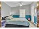 Spacious bedroom with teal and gray color scheme and wood-look floors at 250 W Medina St, Summerville, SC 29483