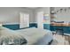 Main bedroom features a built-in desk and teal-colored accent wall at 250 W Medina St, Summerville, SC 29483