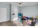 Spare bedroom with wood-look flooring, multiple storage options, and a window at 250 W Medina St, Summerville, SC 29483