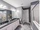 Elegant bathroom with double vanity, granite countertop, and large shower at 3204 Cross Vine Ln, Summerville, SC 29483