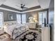 Spacious primary bedroom with wood floors, ceiling fan, and large windows at 3204 Cross Vine Ln, Summerville, SC 29483