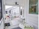 Relaxing screened porch with ceiling fan and outdoor furniture at 3204 Cross Vine Ln, Summerville, SC 29483