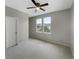 Simple bedroom with grey walls, carpet, and ceiling fan at 376 Watergrass Way, Summerville, SC 29485