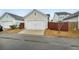 Single car garage with wood fence and driveway at 376 Watergrass Way, Summerville, SC 29485