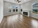 Bright living room featuring hardwood floors and fireplace at 376 Watergrass Way, Summerville, SC 29485