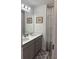 Bathroom with gray vanity, double sinks, and gray rug at 493 Trotters Ln # 116, Moncks Corner, SC 29461