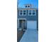 Two-story house with gray siding, attached garage, and landscaping at 493 Trotters Ln # 116, Moncks Corner, SC 29461