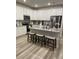 Modern kitchen with white cabinets, granite island, and stainless steel appliances at 493 Trotters Ln # 116, Moncks Corner, SC 29461