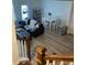 Open living and dining area with L-shaped sectional sofa and hardwood floors at 493 Trotters Ln # 116, Moncks Corner, SC 29461