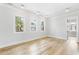 Bright room with hardwood floors, neutral walls, and windows offering plenty of natural light at 6045 Honey Hole Haven, Johns Island, SC 29455