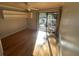 Bedroom with hardwood floors and access to deck at 61 Twin Oaks Ln, Isle of Palms, SC 29451