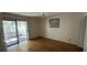 Bedroom with hardwood floors, sliding glass doors to deck, and ceiling fan at 61 Twin Oaks Ln, Isle of Palms, SC 29451