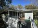 House exterior with deck and surrounding trees at 61 Twin Oaks Ln, Isle of Palms, SC 29451