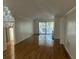 Spacious living room with hardwood floors, fireplace, and access to deck at 61 Twin Oaks Ln, Isle of Palms, SC 29451