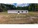 Single-wide manufactured home with large backyard and wooded surroundings at 68 Kickback Cv, Round O, SC 29474