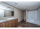 Clean bathroom with shower/tub combo and wood vanity at 68 Kickback Cv, Round O, SC 29474