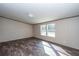 Bright bedroom with two large windows and wood-look floors at 68 Kickback Cv, Round O, SC 29474
