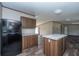Kitchen boasts black appliances and a large kitchen island with granite top at 68 Kickback Cv, Round O, SC 29474