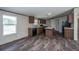 Modern kitchen with wood cabinets, granite countertops, and black appliances at 68 Kickback Cv, Round O, SC 29474