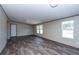 Large living room with kitchen view and laminate flooring at 68 Kickback Cv, Round O, SC 29474