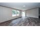 Spacious living room with large windows and laminate floors at 68 Kickback Cv, Round O, SC 29474