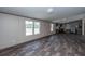 Open concept living room with kitchen and laminate floors at 68 Kickback Cv, Round O, SC 29474