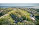 Aerial view of property near golf course and ocean at 7 Dunecrest Trace, Seabrook Island, SC 29455