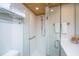 Walk-in shower, modern vanity with white cabinets, and white countertop at 7 Dunecrest Trace, Seabrook Island, SC 29455