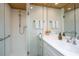 Walk-in shower, modern vanity with white cabinets, and white countertop at 7 Dunecrest Trace, Seabrook Island, SC 29455