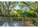 Wooden deck surrounded by trees, providing shade and tranquility at 7 Dunecrest Trace, Seabrook Island, SC 29455