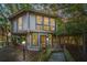 Unique treehouse home at dusk, showcasing its elevated design and surrounding nature at 7 Dunecrest Trace, Seabrook Island, SC 29455