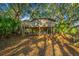 Treehouse home nestled amongst mature trees; showcasing the home's unique architecture and elevated position at 7 Dunecrest Trace, Seabrook Island, SC 29455