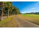 Landscaped path alongside a scenic golf course at 7 Dunecrest Trace, Seabrook Island, SC 29455