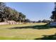 Scenic golf course view with lush greens and mature trees at 7 Dunecrest Trace, Seabrook Island, SC 29455