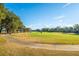Golf course path with homes and lush trees at 7 Dunecrest Trace, Seabrook Island, SC 29455
