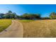 Golf course path with homes and lush trees at 7 Dunecrest Trace, Seabrook Island, SC 29455
