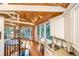 Charming kitchen with granite countertops, white cabinets, and a breakfast bar at 7 Dunecrest Trace, Seabrook Island, SC 29455