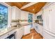 Well-equipped kitchen with granite countertops and white cabinetry at 7 Dunecrest Trace, Seabrook Island, SC 29455