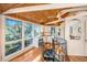 Open-concept kitchen with white cabinets and wood ceiling at 7 Dunecrest Trace, Seabrook Island, SC 29455