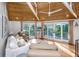 Spacious living room with hardwood floors, comfortable seating, and large windows at 7 Dunecrest Trace, Seabrook Island, SC 29455
