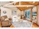 Cozy living room with hardwood floors, comfortable seating, and access to a deck at 7 Dunecrest Trace, Seabrook Island, SC 29455