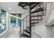 Black metal spiral staircase in a bright, modern home at 7 Dunecrest Trace, Seabrook Island, SC 29455