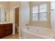 Bathroom features a garden tub and separate toilet area at 7315 Coopers Hawk Dr, Hanahan, SC 29410