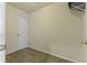 Small bedroom with carpeted floor and a white door at 7315 Coopers Hawk Dr, Hanahan, SC 29410