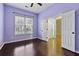 Bright bedroom with hardwood floors, neutral walls, and double doors at 7315 Coopers Hawk Dr, Hanahan, SC 29410